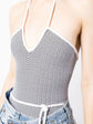 White and black chevron patterned Chanel halterneck swimsuit, stylish swimwear with a sophisticated design.