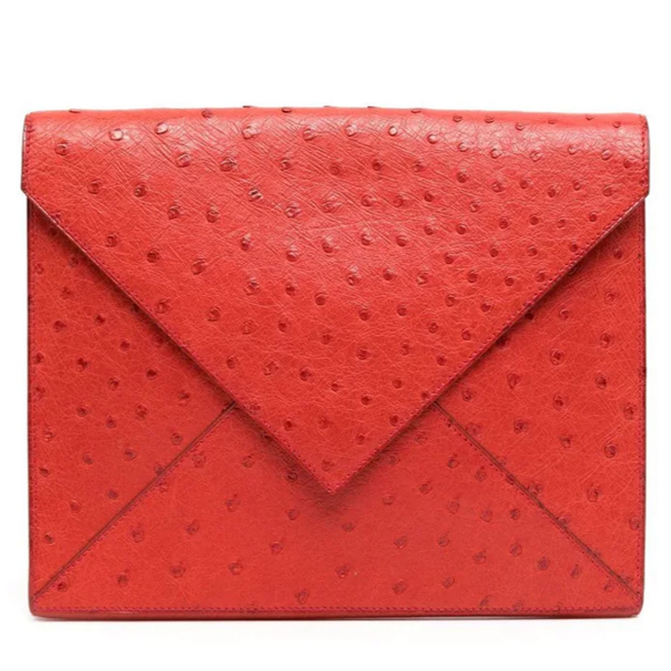 Hermès Red Ostrich Liddy Clutch Bag with envelope-style fold-over shape, vibrant red exotic leather, ostrich quill texture and minimalist structured silhouette.