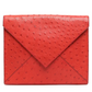 Hermès Red Ostrich Liddy Clutch Bag with envelope-style fold-over shape, vibrant red exotic leather, ostrich quill texture and minimalist structured silhouette.