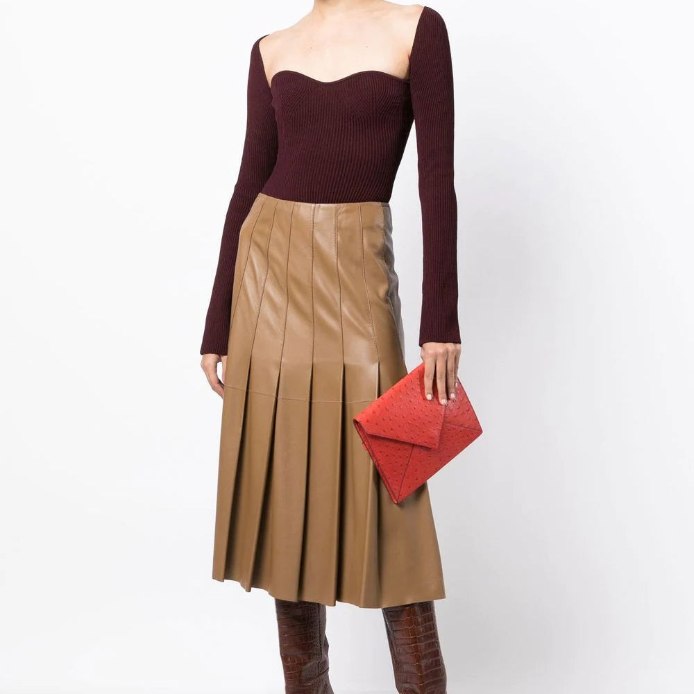 Hermès Red Ostrich Liddy Clutch Bag with envelope-style fold-over shape, vibrant red exotic leather, ostrich quill texture and minimalist structured silhouette.