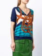 Hermès navy bridle print silk top featuring a stylish blouse design with elegant horse-themed pattern.