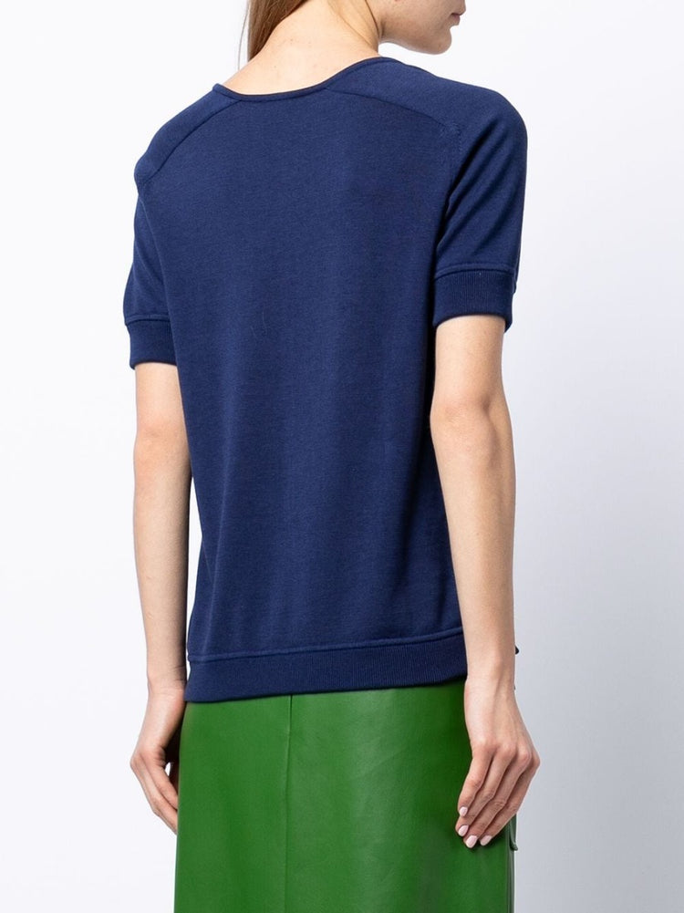 Hermès navy Bridle print silk top featuring elegant design and smooth fabric, styled with long sleeves and a classic neckline.