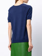 Hermès navy Bridle print silk top featuring elegant design and smooth fabric, styled with long sleeves and a classic neckline.