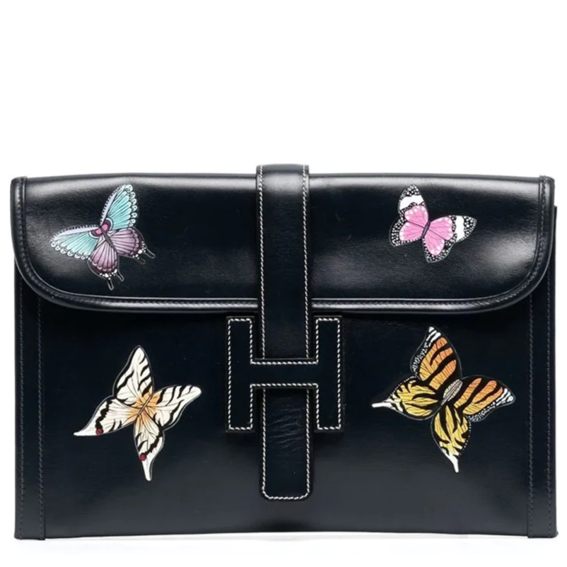 Hermès Butterfly Jige Elan PM black clutch with butterfly design, showcasing elegant craftsmanship and luxurious leather.