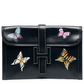 Hermès Butterfly Jige Elan PM black clutch with butterfly design, showcasing elegant craftsmanship and luxurious leather.