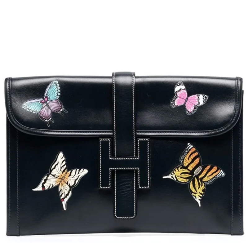 Hermès Butterfly Jige Elan PM black clutch with butterfly design, showcasing elegant craftsmanship and luxurious leather.