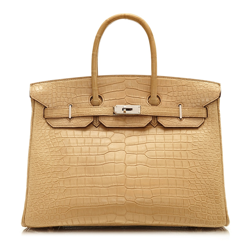 Hermès Birkin 35 bag in Parchemin beige Porosus crocodile leather with dual rolled handles, palladium-tone hardware, front flap, belted straps, and turn-lock closure.