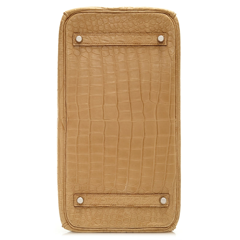 Hermès Birkin 35 bag in Parchemin beige Porosus crocodile leather with dual rolled handles, palladium-tone hardware, front flap, belted straps, and turn-lock closure.