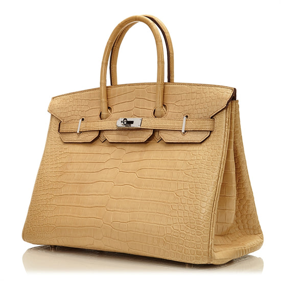 Hermès Birkin 35 bag in Parchemin beige Porosus crocodile leather with dual rolled handles, palladium-tone hardware, front flap, belted straps, and turn-lock closure.