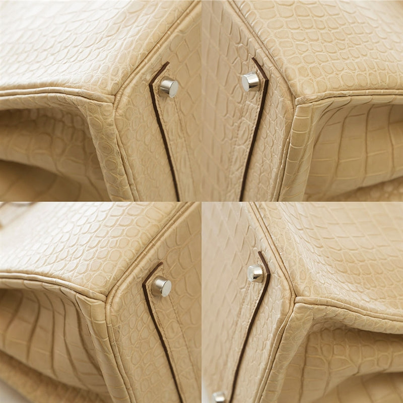 Hermès Birkin 35 bag in Parchemin beige Porosus crocodile leather with dual rolled handles, palladium-tone hardware, front flap, belted straps, and turn-lock closure.
