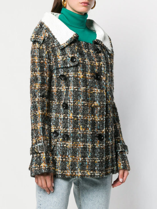 Vintage Comme Des Garçons double-breasted blazer with structured lapels and tailored fit, displayed on a hanger.