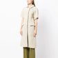Bottega Veneta light beige short-sleeved jacquard coat with textured woven pattern, rounded collar, concealed fastening and flap pockets.