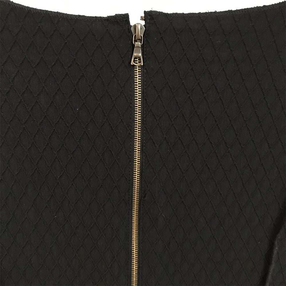Black shift dress by Other Designers, showcasing a sleek, tailored silhouette with long sleeves and minimalistic style.