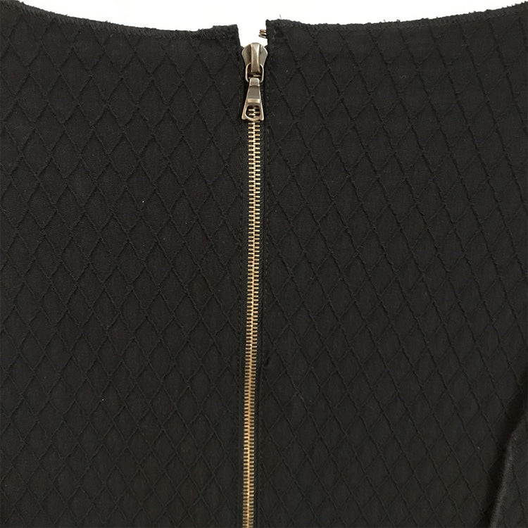 Black shift dress by Other Designers, showcasing a sleek, tailored silhouette with long sleeves and minimalistic style.