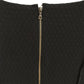 Black shift dress by Other Designers, showcasing a sleek, tailored silhouette with long sleeves and minimalistic style.