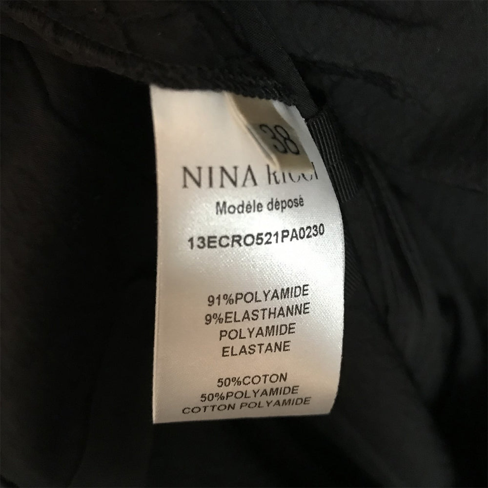 Nina Ricci black shift dress, elegant sleeveless design with a tailored fit, perfect for stylish occasions.