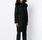 Black Prada Jacquard Astrakhan coat featuring textured fabric and tailored design, displayed on a mannequin.