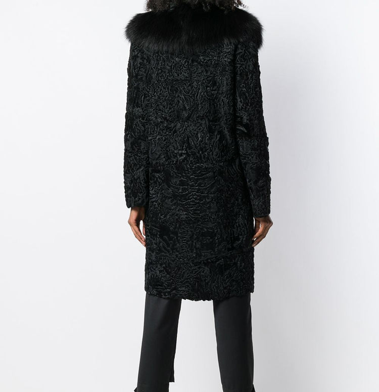 Black Prada Jacquard Astrakhan coat with textured woven fabric and classic tailored design, displayed on a hanger.