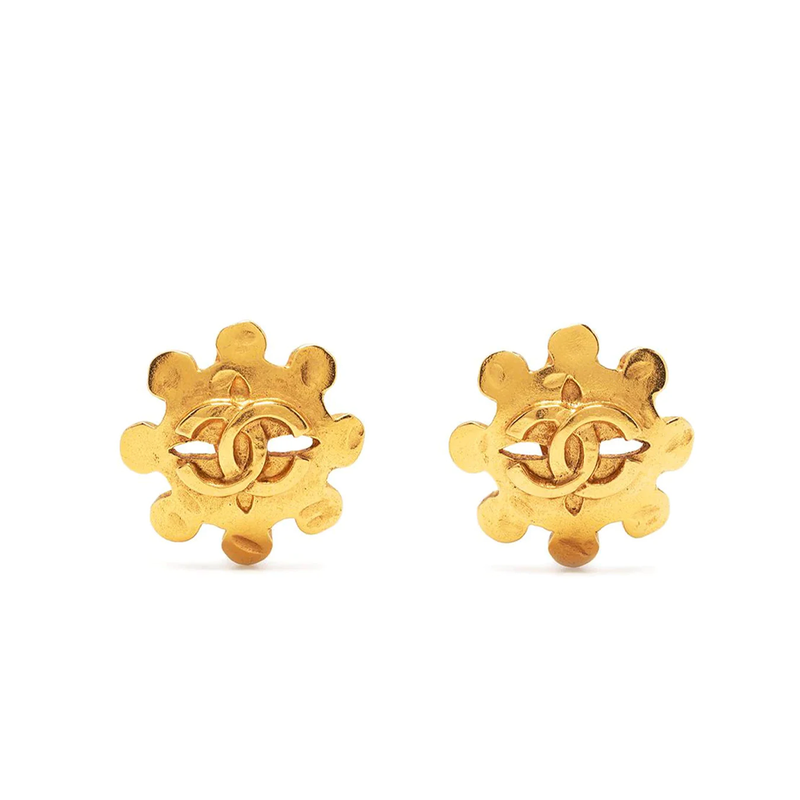 Chanel gold cut out wheel clip-on earrings, front view of pair