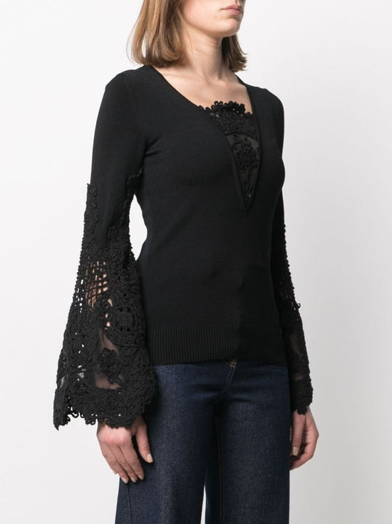 Chanel black crochet sleeve jumper, close-up of sheer crochet lace sleeve panel