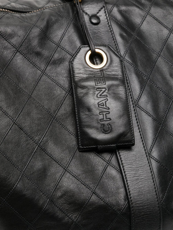 Chanel Diamond Quilted Boston Travel Bag, detail of gold-tone hardware