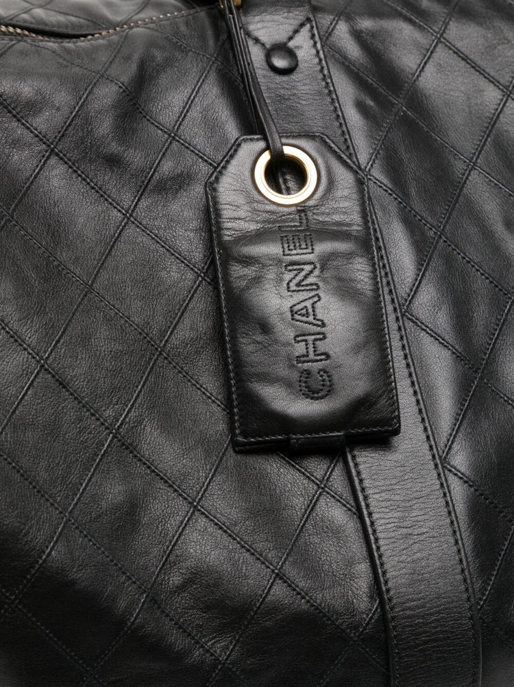 Chanel Diamond Quilted Boston Travel Bag, detail of gold-tone hardware
