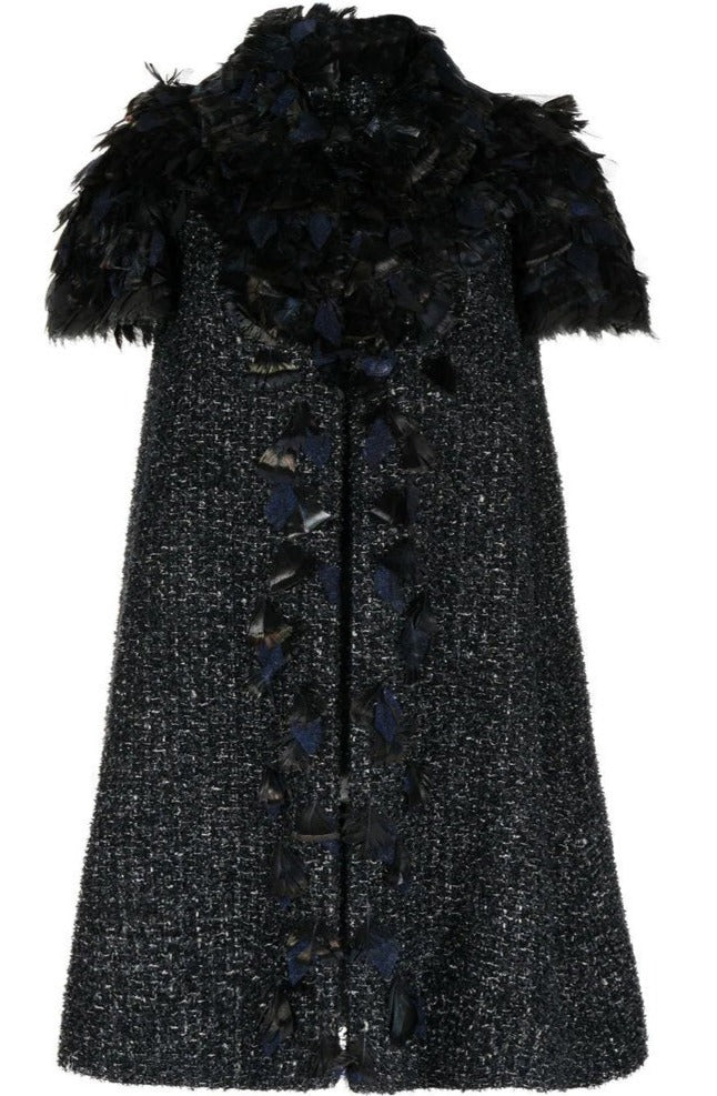 Chanel feather-embellished tweed coat with decorative feather accents, stylish outerwear for a sophisticated look.