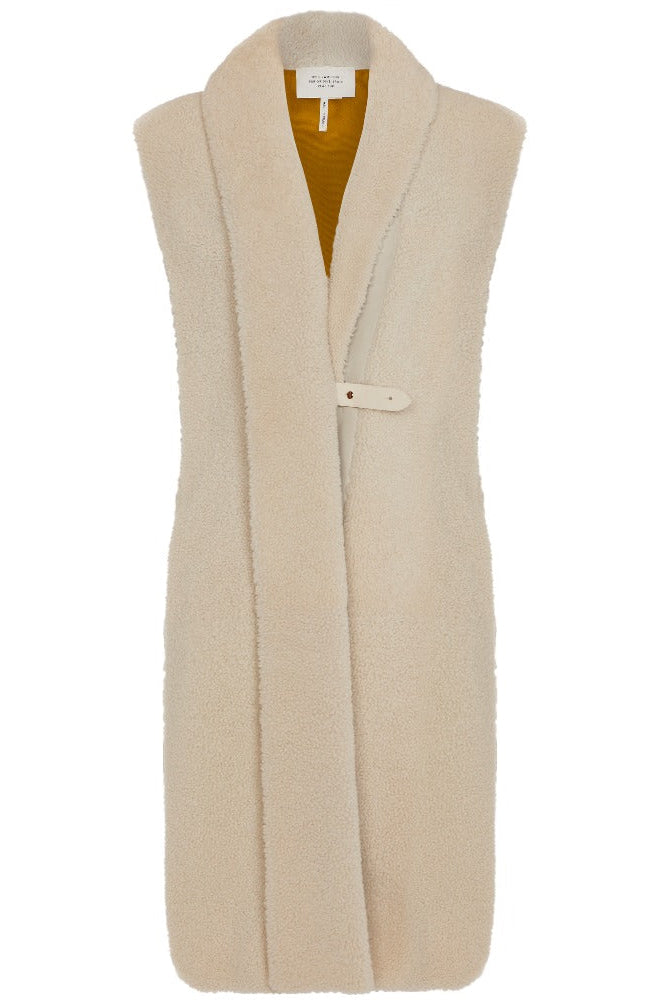 Hermès sheepskin gilet with silk scarf interior, stylish blazer or jacket featuring luxurious materials and elegant design.
