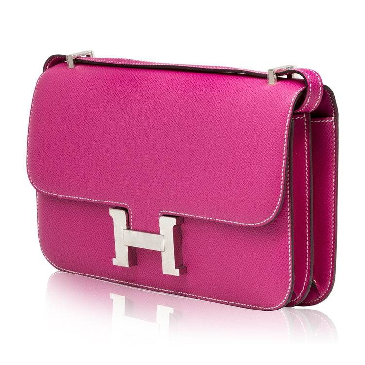 Hermès Tyrien pink Epsom leather Constance Elan shoulder bag with gold hardware and structured design.